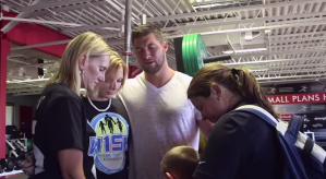 Tim Tebow Prays, Fulfills Wish of Terminally Ill Girl