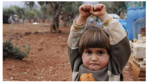 Heartbreaking Photo of Syrian Girl Raising Hands in Surrender