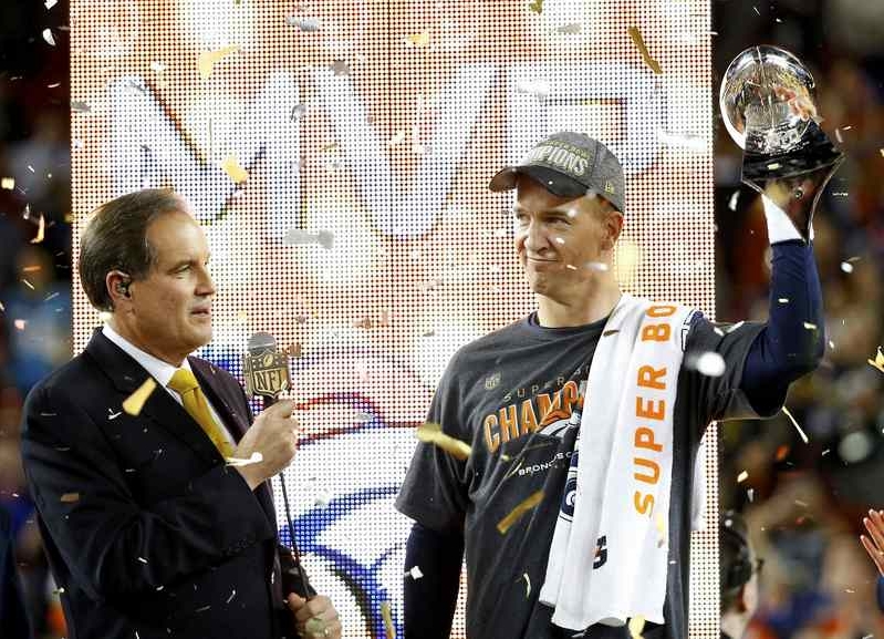 Denver Broncos' quarterback Peyton Manning holds the Vince Lombardi Trophy after the Broncos defeated the Carolina Panthers in the NFL's Super Bowl 50 football game in Santa Clara