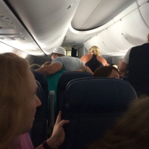 Tim Tebow with Delta passenger