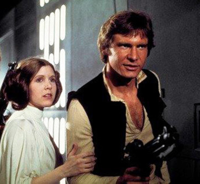 Carrie Fisher as Princess Leia Organa and Harrison Ford as Han Solo in the original 1977 