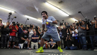 Christian Boxer Manny Pacquiao on Fight against Floyd Mayweather: 'The Lord Will Deliver Him Into My Hands'