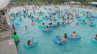 Alert Lifeguard Saves Drowning Child in a Middle of a Packed Pool Full of People