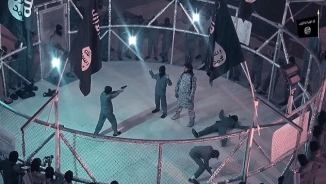 ISIS Releases Shocking Propaganda Video of Young Boys Locked in Cage Forced to Fight Each Other