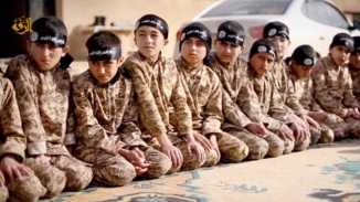 ISIS Teaching Child Fighters to Behead Prisoners Using Dolls: 'They Told Me It Was Head of Infidels'  