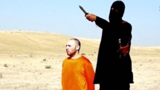 'Jihadi John' Resurfaces in Ominous New ISIS Video, Vows to Return to UK and 'Behead Nonbelievers' 