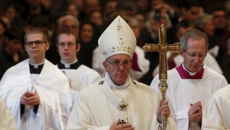 Vatican Condemns 'Woeful' Charlie Hebdo Cover Depicting God As Gun-Carrying Killer