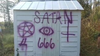 Air Force Members Arrested for Spray Painting Satanic Symbols on Historic Church